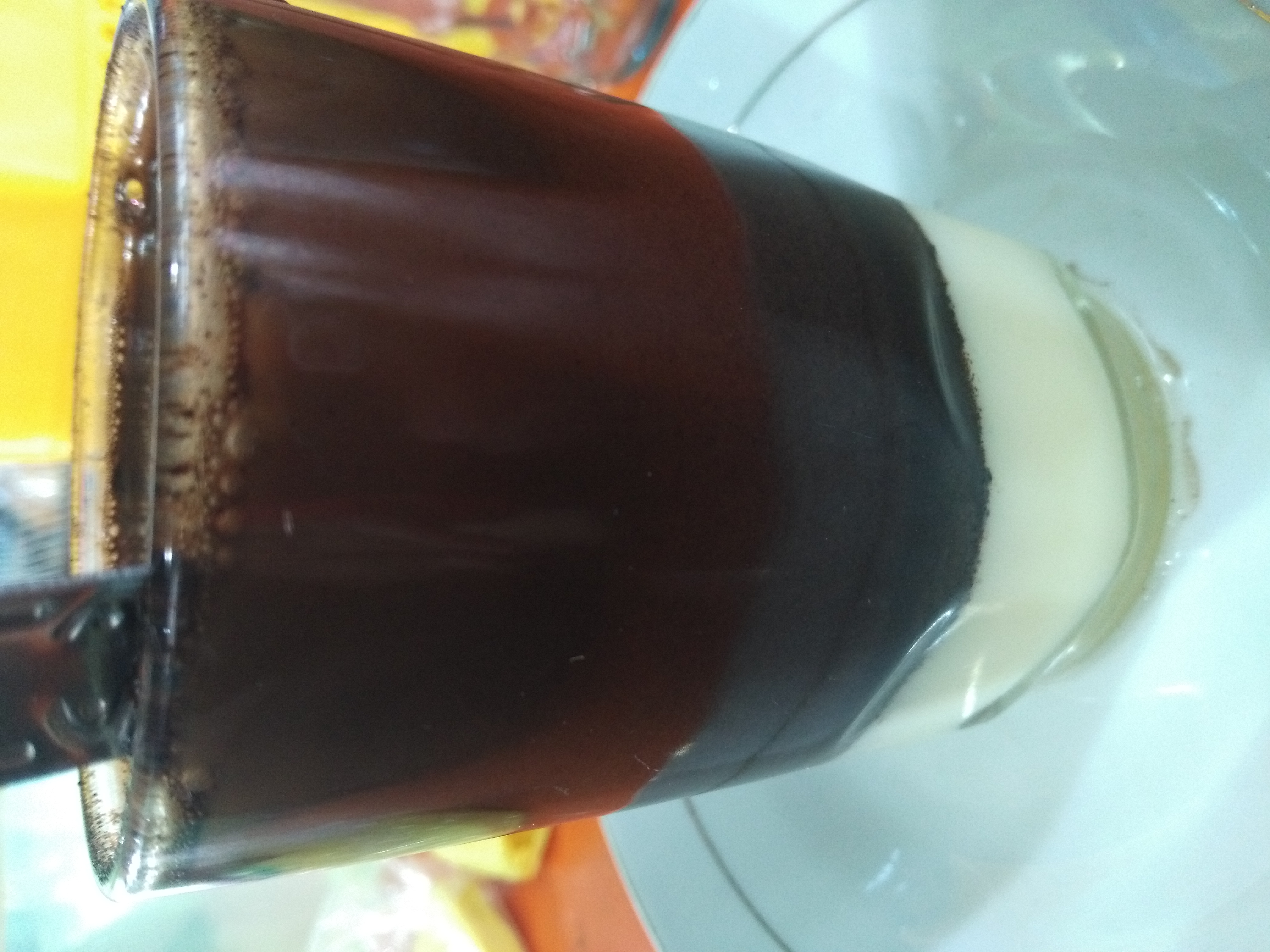 Kopi Susu, lit. 'milk coffee.' More specifically, coffee with a slab of condensed milk at the bottom.