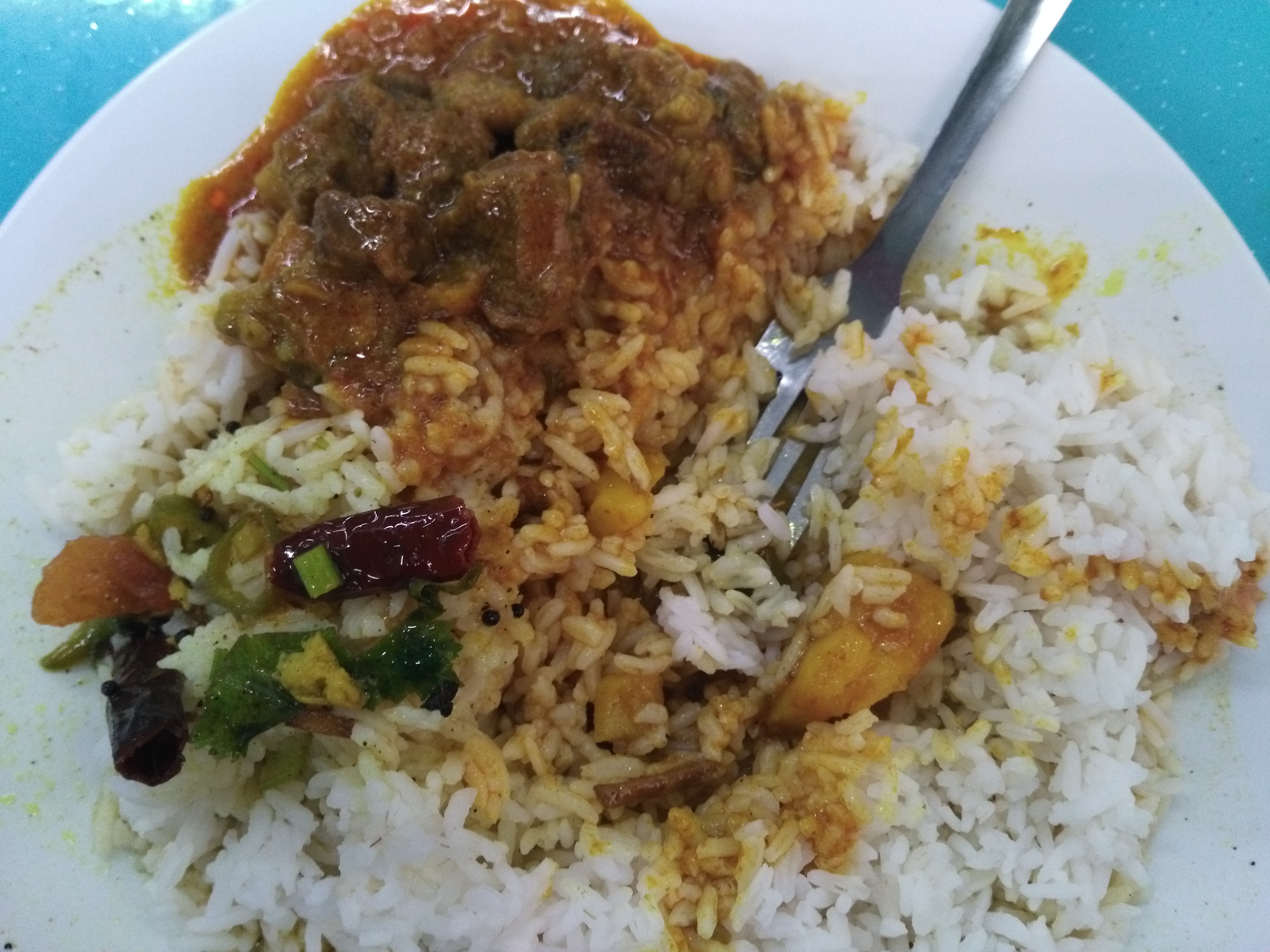 Beef curry (<i>goru torkari</i>) and rice (<i>bhaat</i>) at a Bangladeshi joint in Kuala Lumpur.