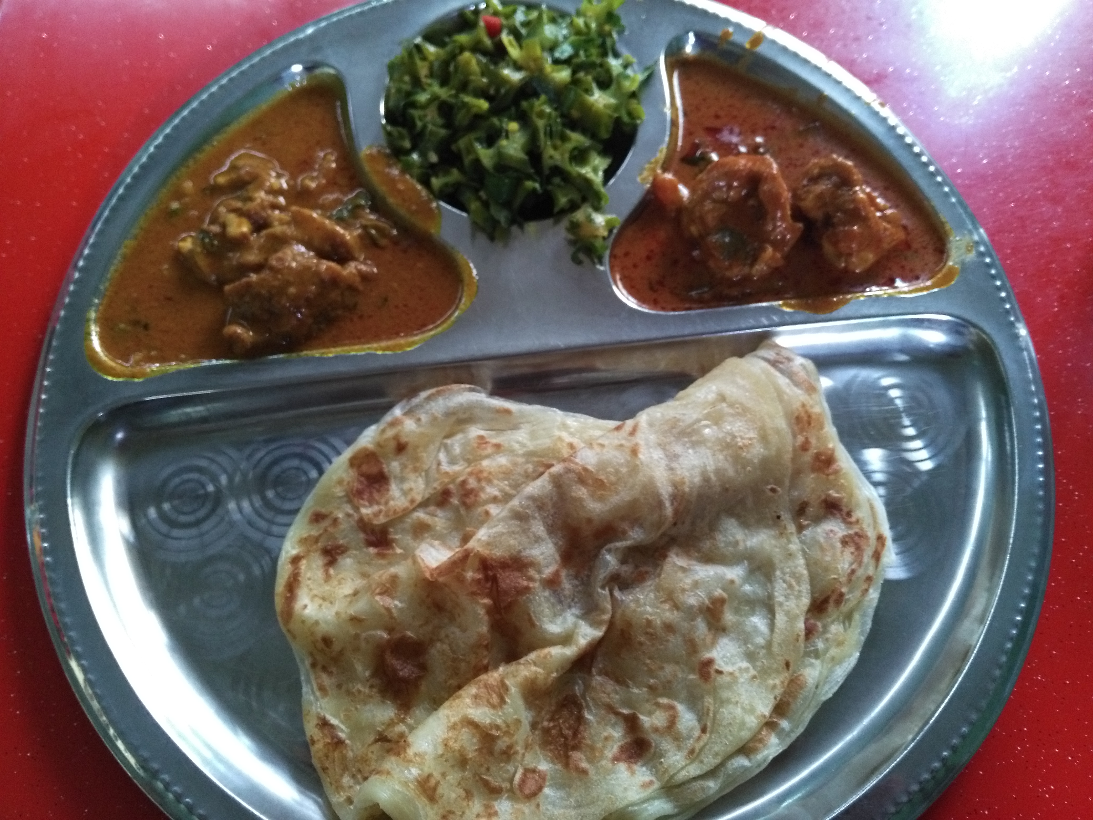 Roti chennai (aka. paratha) with beef curry, chicken curry, and stir fried okra.