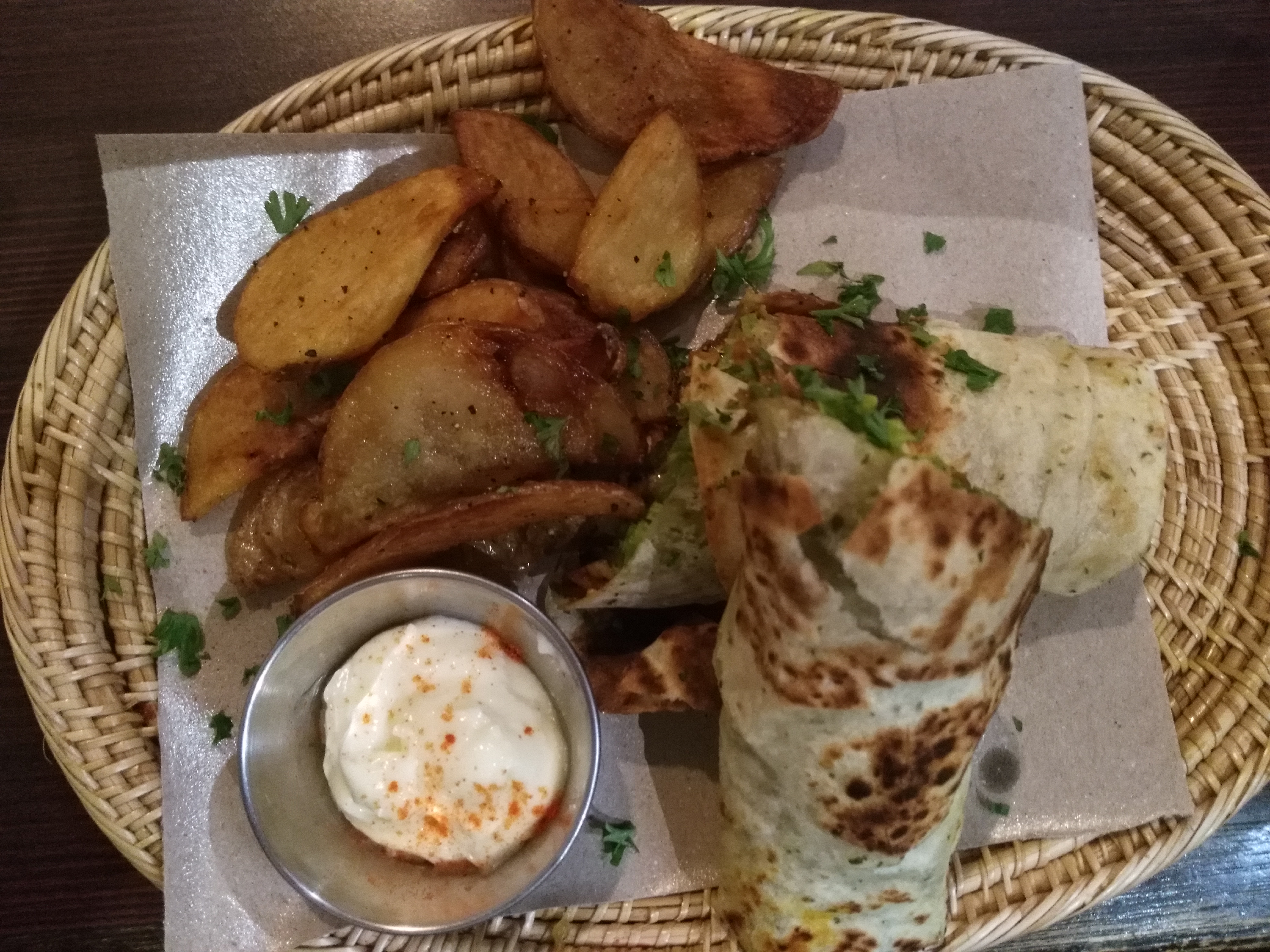 Chicken shawarma wrap with a side of fries.