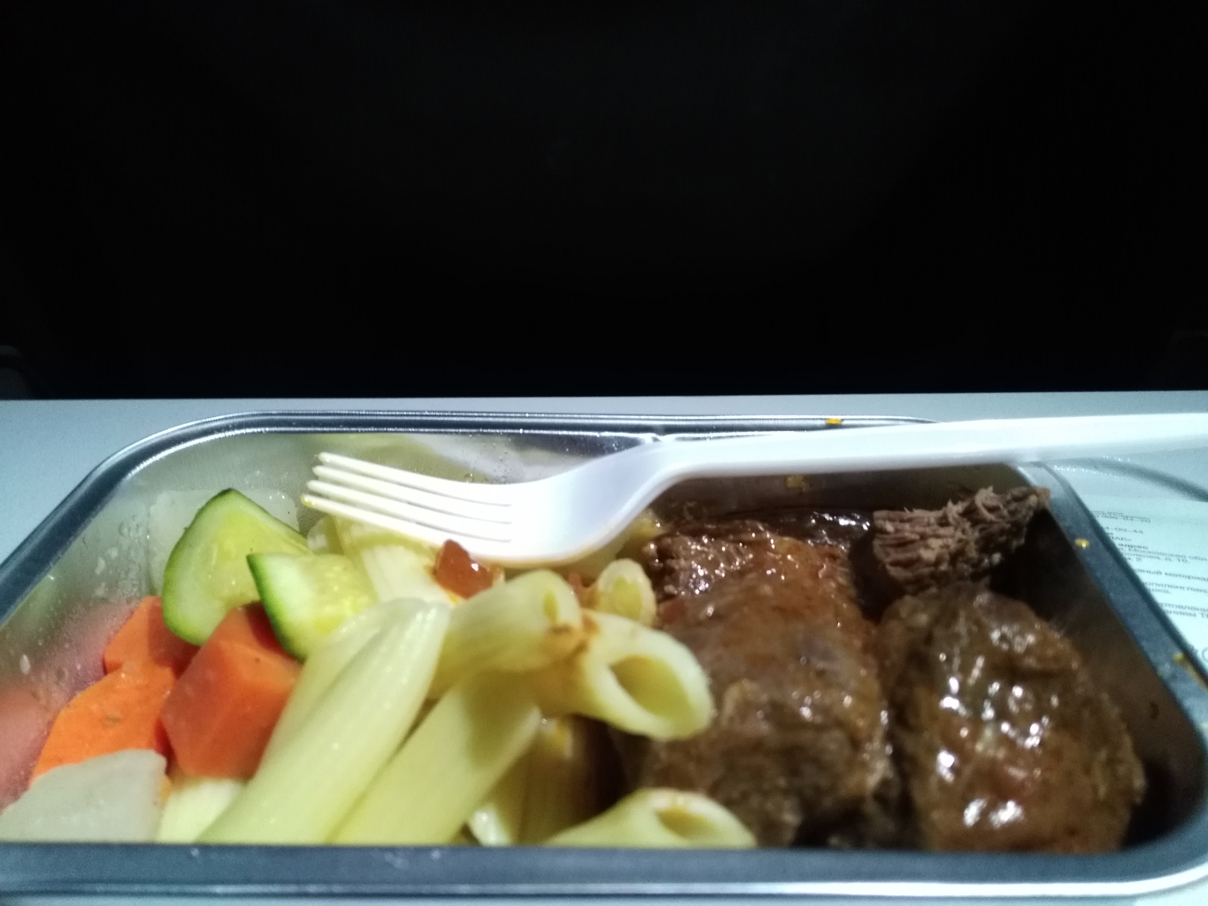 Beef goulash and pasta w/ steamed vegetables airplane style. 