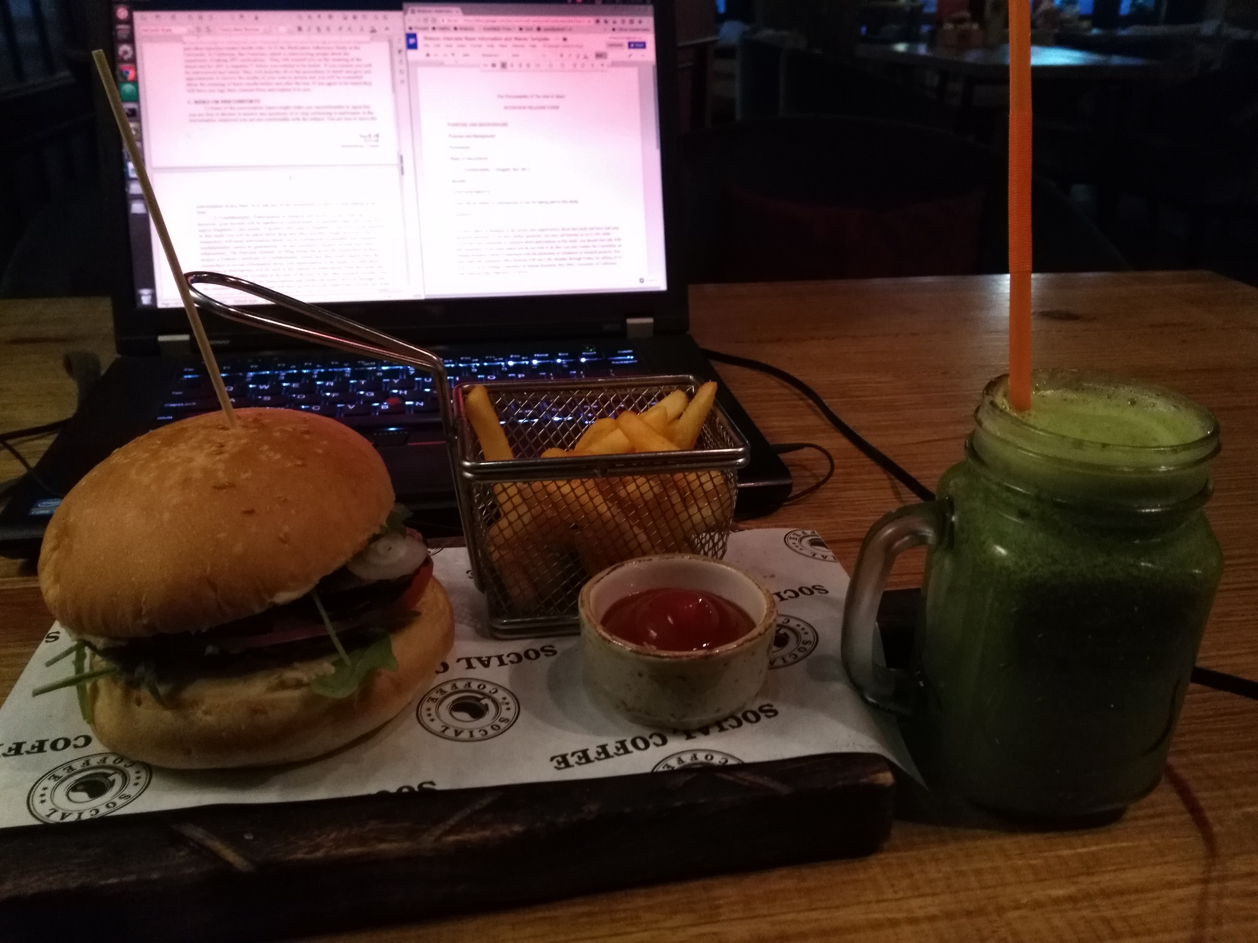 Veggie burger, green smoothie, and fries. One of the few vegan meals I've had since the start of my Watson.