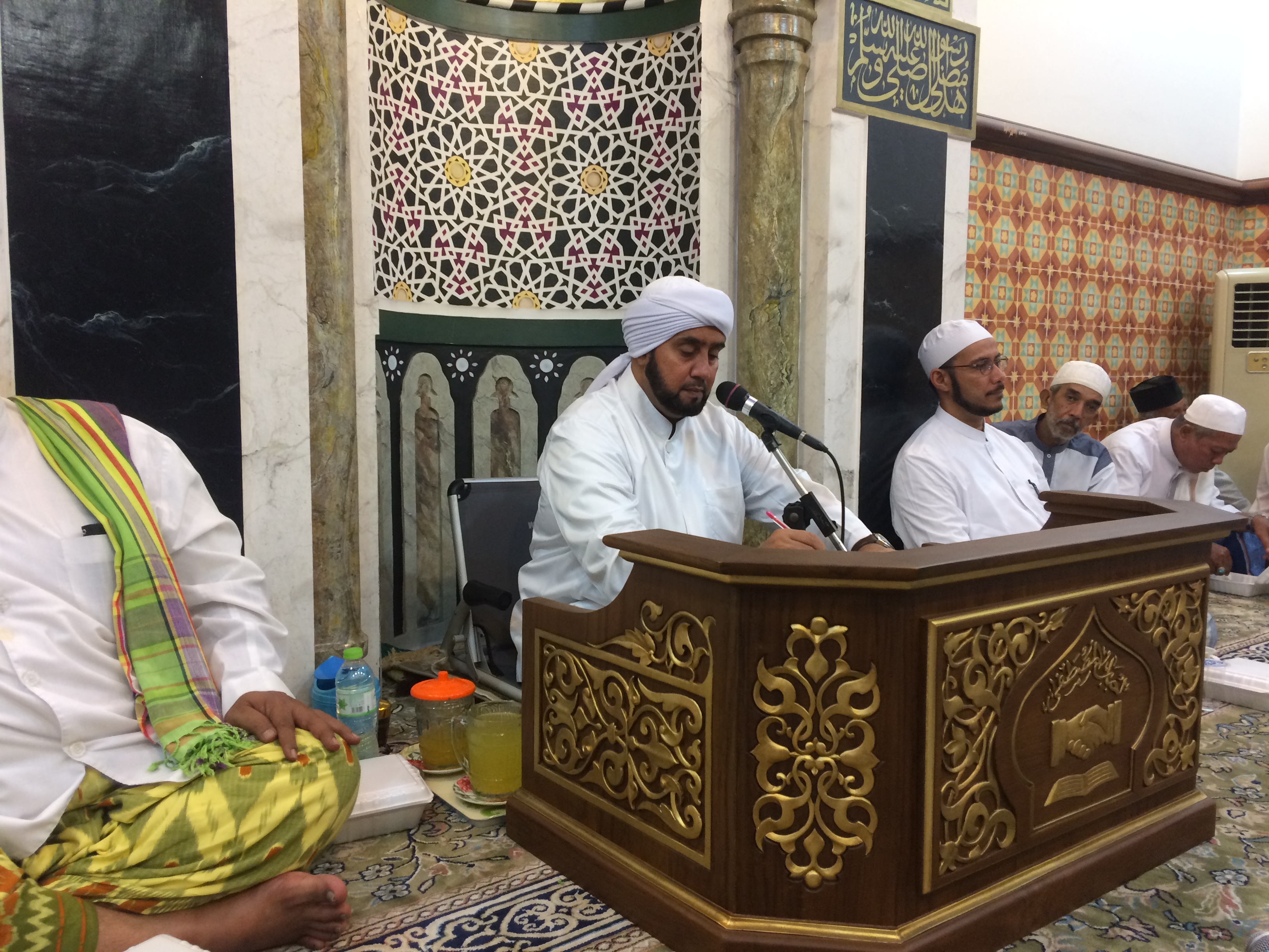 Habib Syeh (center) at his 'pulpit' in the 'private' chamber in front of the main hall area.